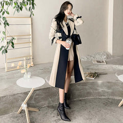 Fashionable Autumn Women's Long Trench Coat in khaki with stylish design and elegant silhouette.