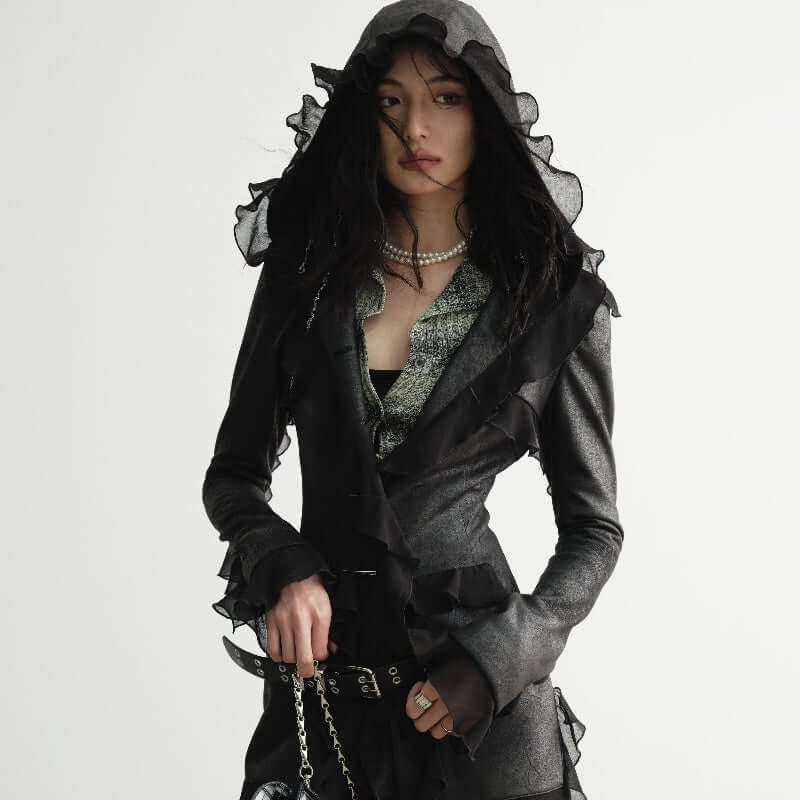 Dalian Hat Suede Slim-fit Thin Ruffled Overlong Coat modeled by a woman with long sleeves and a hood.