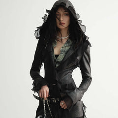 Dalian Hat Suede Slim-fit Thin Ruffled Overlong Coat modeled by a woman with long sleeves and a hood.