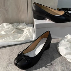 Luxury split toe women's pumps in black with a bow, featuring a comfortable low heel, perfect for casual occasions.