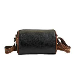Stylish women's leather crossbody handbag in black with adjustable strap for versatile use.