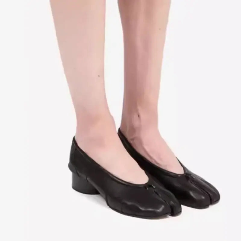 Luxury split toe women's pumps in black with unique hoof heels, perfect for casual occasions.