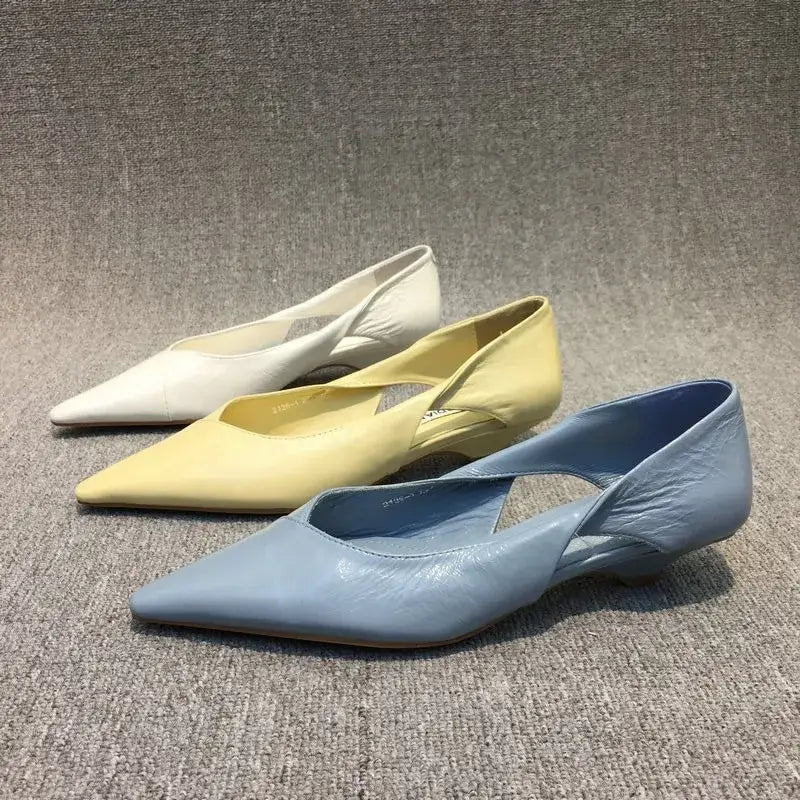 comfortable summer moccasins for women in blue, yellow, and white pointed toe designs on a gray background.
