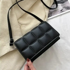 Small PU leather crossbody bag with a quilted surface and adjustable strap, perfect for women, stylish and versatile.