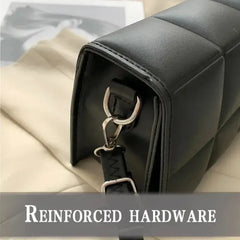 small PU leather crossbody bag showing reinforced hardware detail and stylish design.