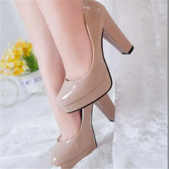 Women's pointed toe high heel pumps in nude color with chunky heels, perfect for formal and wedding occasions.