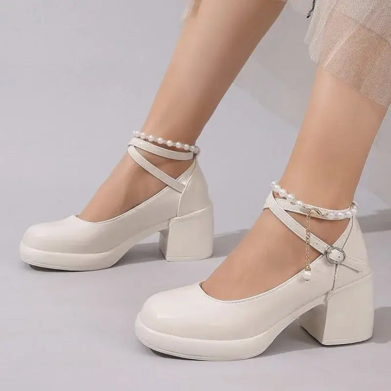 Elegant cross strap high heel pumps in white with pearl ankle straps, perfect for stylish women's footwear.