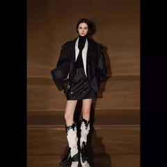 Model wearing a Loose Wide Retro British Trench Coat with a stylish black skirt and unique boots.