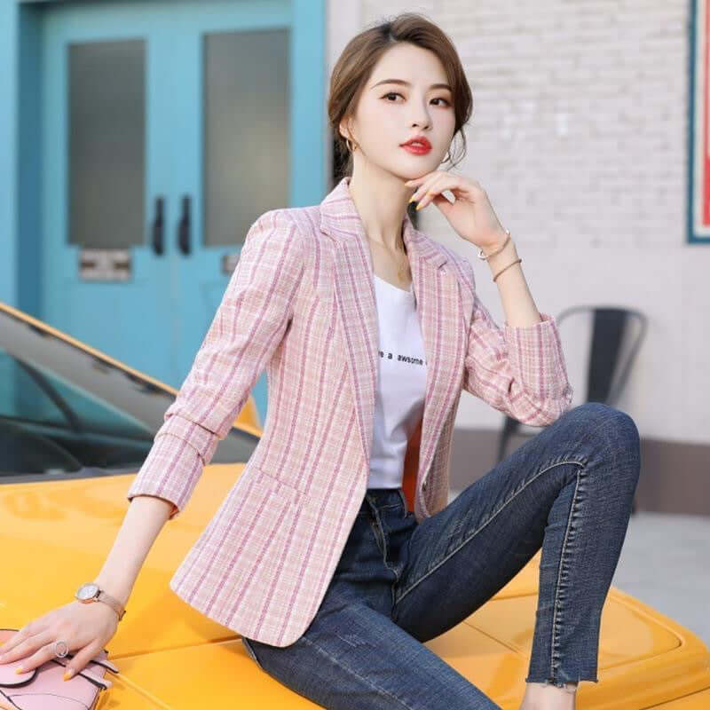 Korean Style British Casual Plaid Short Suit worn by a woman, pink plaid blazer with jeans, stylish outdoor setting.