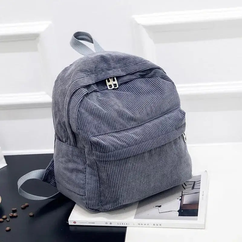 Fashionable zipper backpack for women, corduroy backpack, collegiate style versatile personalized backpack.