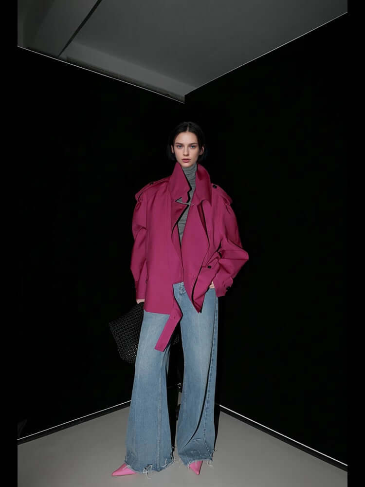 Loose Wide Retro British Trench Coat worn by model, featuring pink color and flared jeans against a dark background.